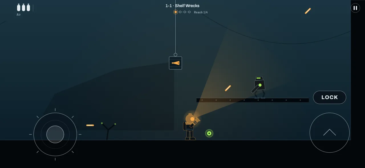 A reach on the Wreck Shelf: the diver aims up at a gunner machine on a ledge while a cargo crate hangs on a cable overhead.