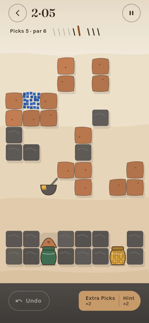A level: clay cups of pigment, a stone mortar and glazed pots on a rock floor